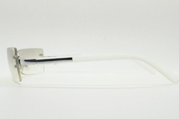 Y2K vintage  frameless sunglasses. Minimal light tone curved mirrored lenses with white frosted arms. 2000's. 90s. 00s. NOS