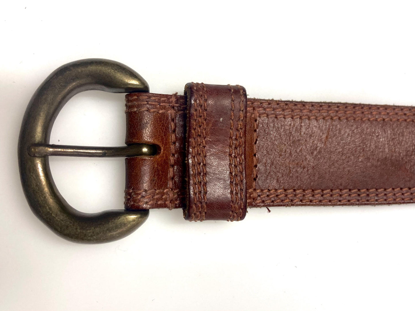 80s vintage jeans or trousers belt with brass buckle. Tan brown substantial single cut genuine leather construction with triple stitching