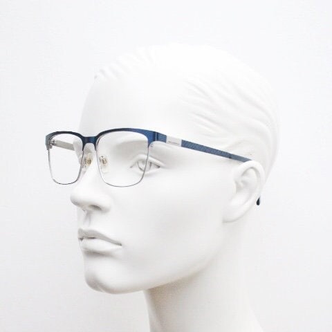 Karl Lagerfeld squared wayfarer shape eye glasses. Navy check pattern arms with satin finish brow optical frames. Prescription eyeglasses.