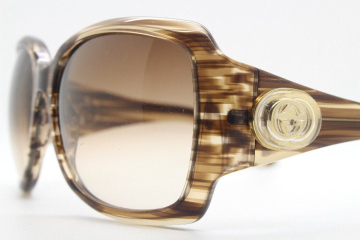 Gucci Y2K vintage oversized square sunglasses made in Italy. Transparent mottled brown frame with glitter sparkles and big stand out logo