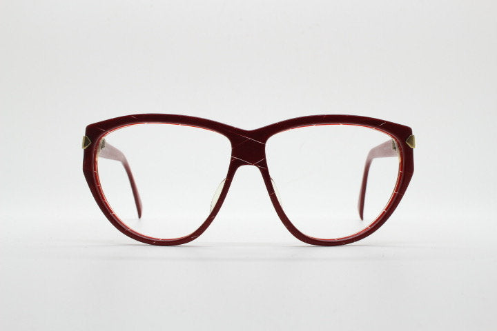 Silhouette 80s vintage oversized cat eye glasses made in Austria. Dramatic red prescription optical frame with subtle criss cross stripes RX
