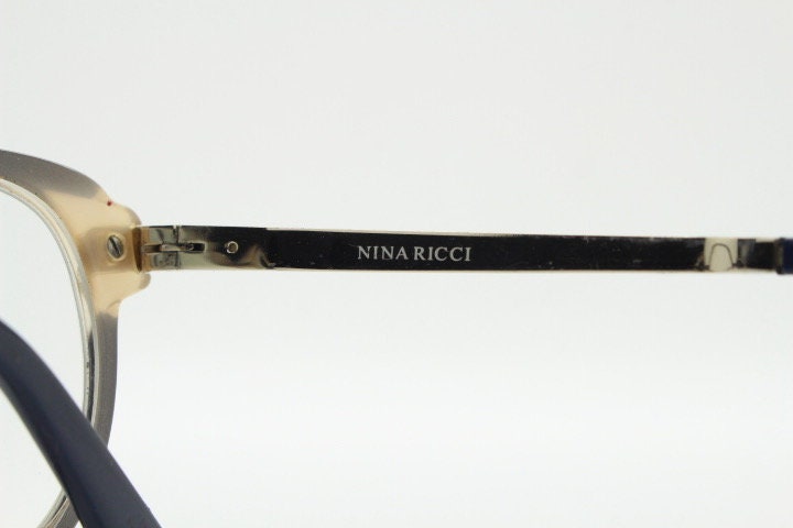 Nina Ricci vintage cat eye glasses. Yellow crystal and black acetate cateye optical frames gold metal arms. Womens prescription spectacles