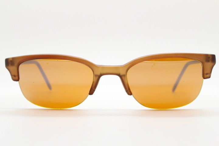 90s vintage low profile cat eye sunglasses. Transparent half frame cateye with matching mirror glazed light tone lenses. NOS