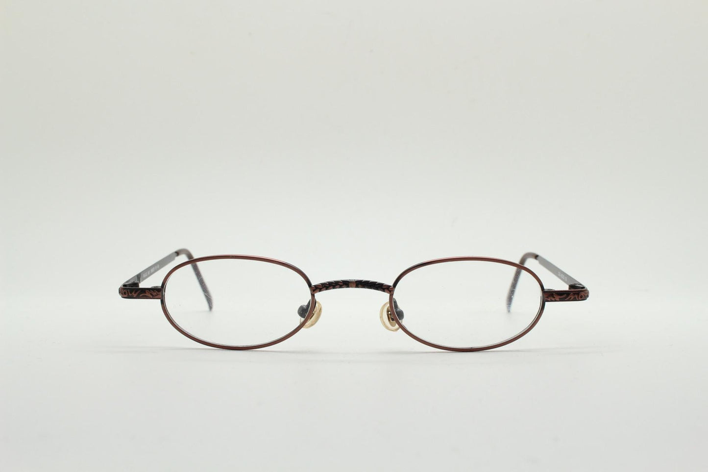 Paris Ma 90s vintage small oval eye glasses. Brushed copper finish optical frames with ornate details. Prescription steampunk spectacles NOS