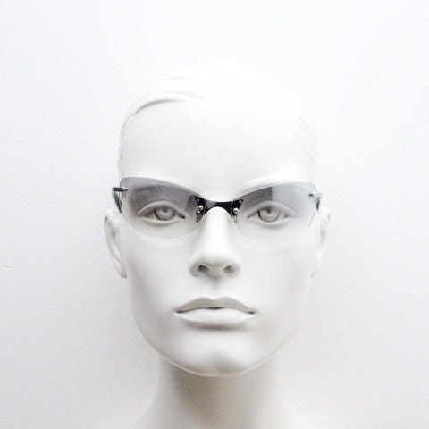 Y2K vintage wraparound sunglasses. Low profile frameless design in black matt finish with light tone graduated mirror lenses. 2000's. NOS