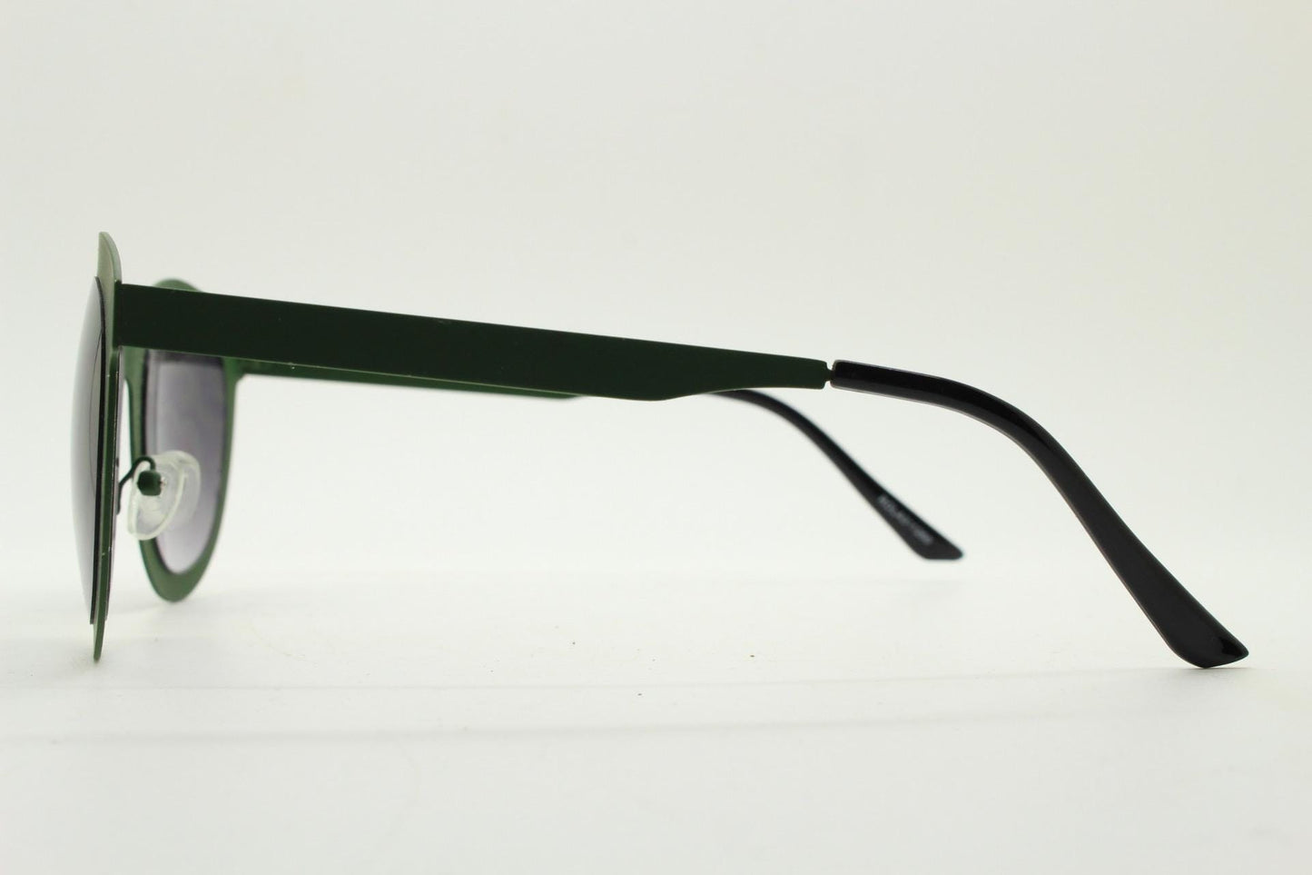 Round vintage cat eye sunglasses. Green flat metal frame in a slightly rubber finish that encases the lenses. Womens 2000s modified cateye