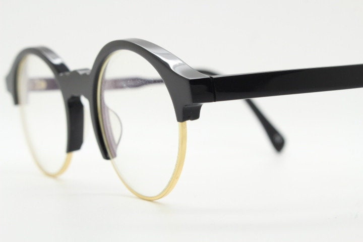 Kaleos round half frame eye glasses. Black gloss acetate browline optical frames with gold underwire. Prescription eyeglasses. RX