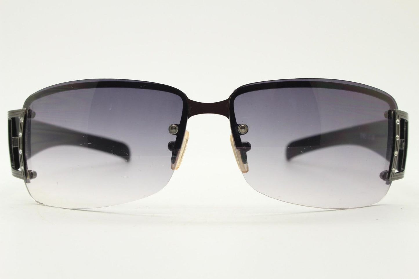 Y2K vintage rectangular wrap around sunglasses. Black half frame with grey metal trim, diamante detail and graduating lenses. Rhinestone