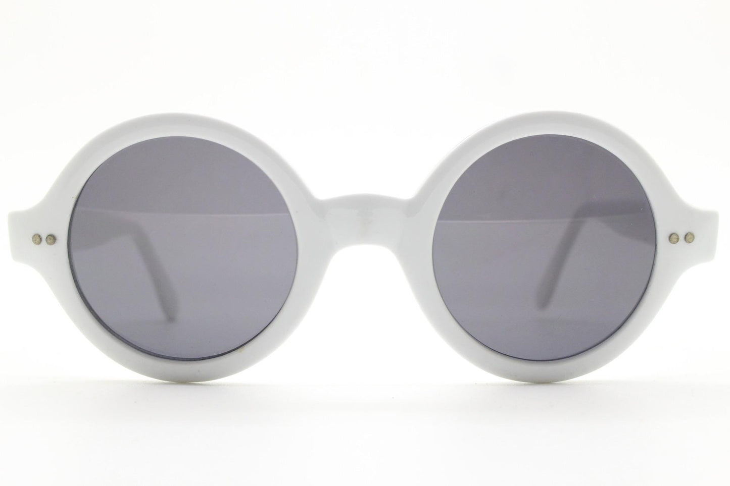 90s vintage round monochrome sunglasses. 30s design in an ice white frame with plain black lenses. Quality construction unused NOS