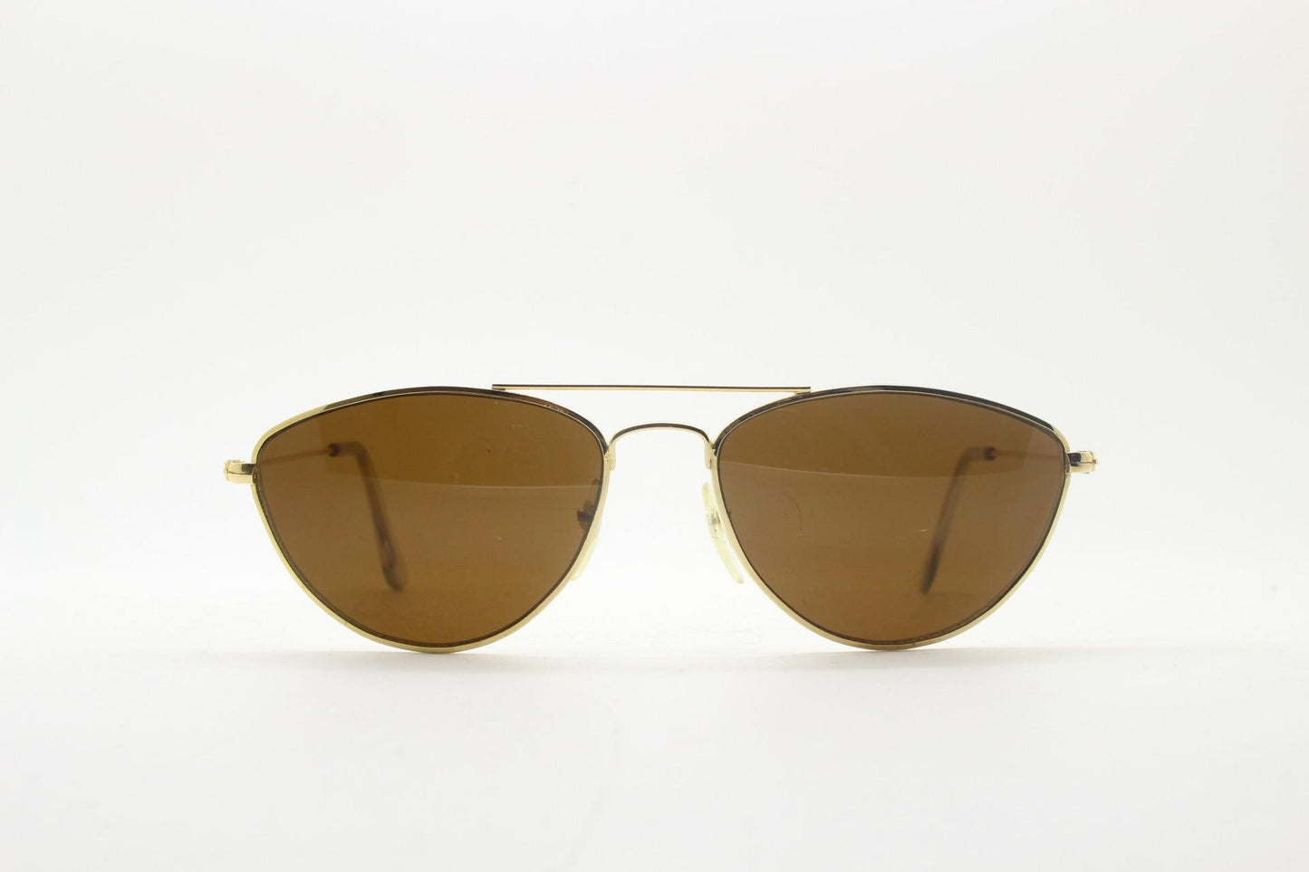 90s vintage minimal triangular sunglasses. Slim gold frame with plain brown lenses. Small modified aviator design. NOS