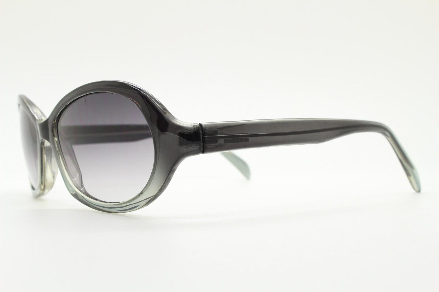 Y2K vintage oval bug eye sunglasses. Tasteful transparent grey acetate frame with matching graduated lenses. 2000s NOS. BNWT