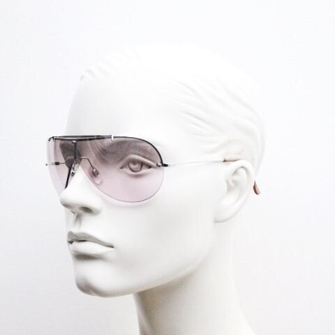 Y2K vintage visor shield sunglasses. Silver chrome half frame with pink wraparound mono lens and mirror glaze. Mini mask. 00's. 2000's NOS