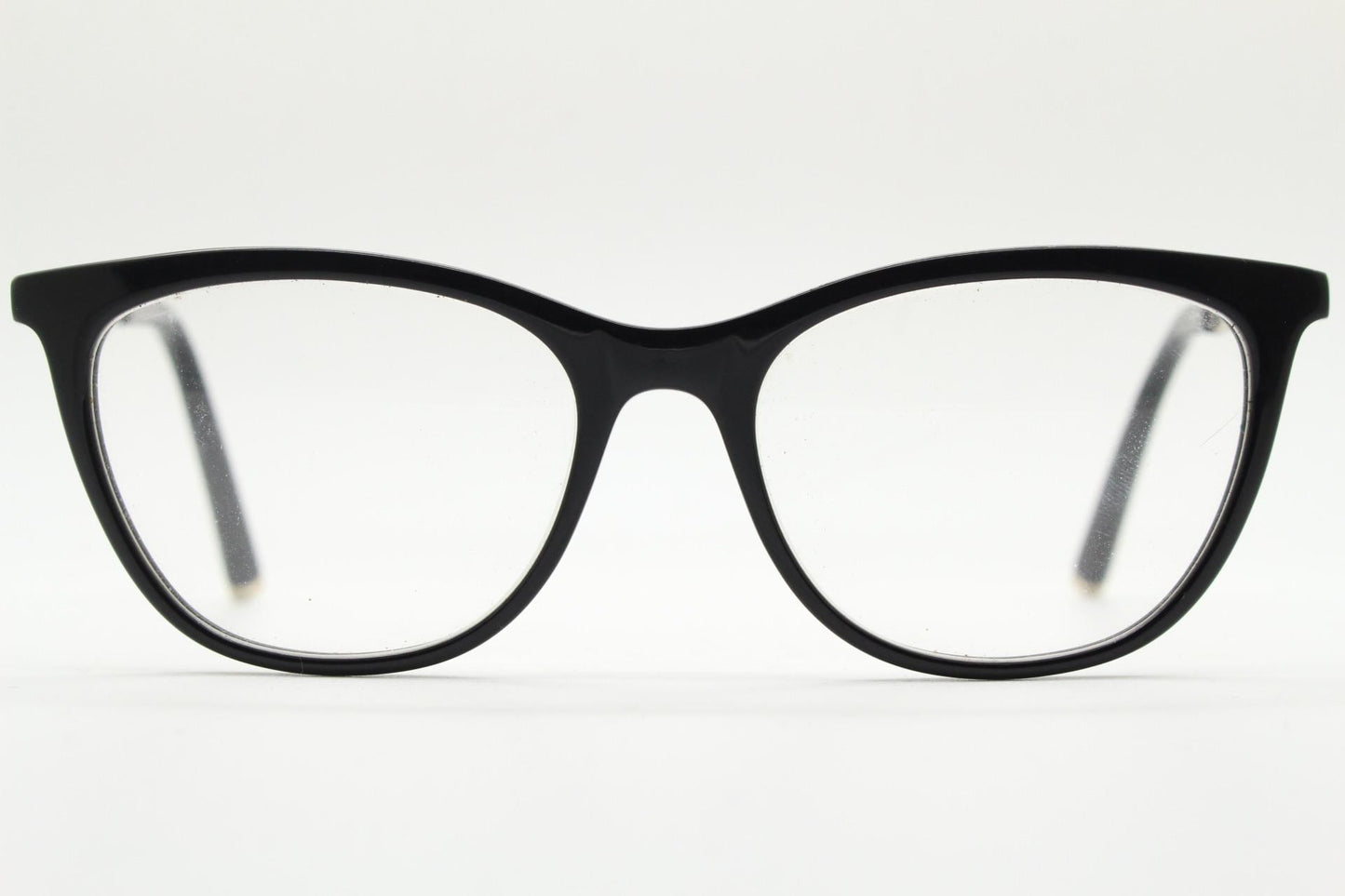 Vintage elegant cat eye glasses by Heritage. Black gloss acetate optical frames with leather lattice arms. Prescription RX cateye spectacles