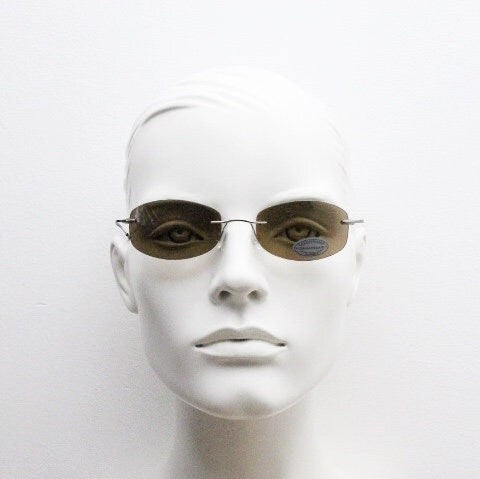 Faconnable 90s vintage sunglasses model 859 hand made in Italy. Minimal frameless design with flexible wire arms and brown chrome trim. NOS