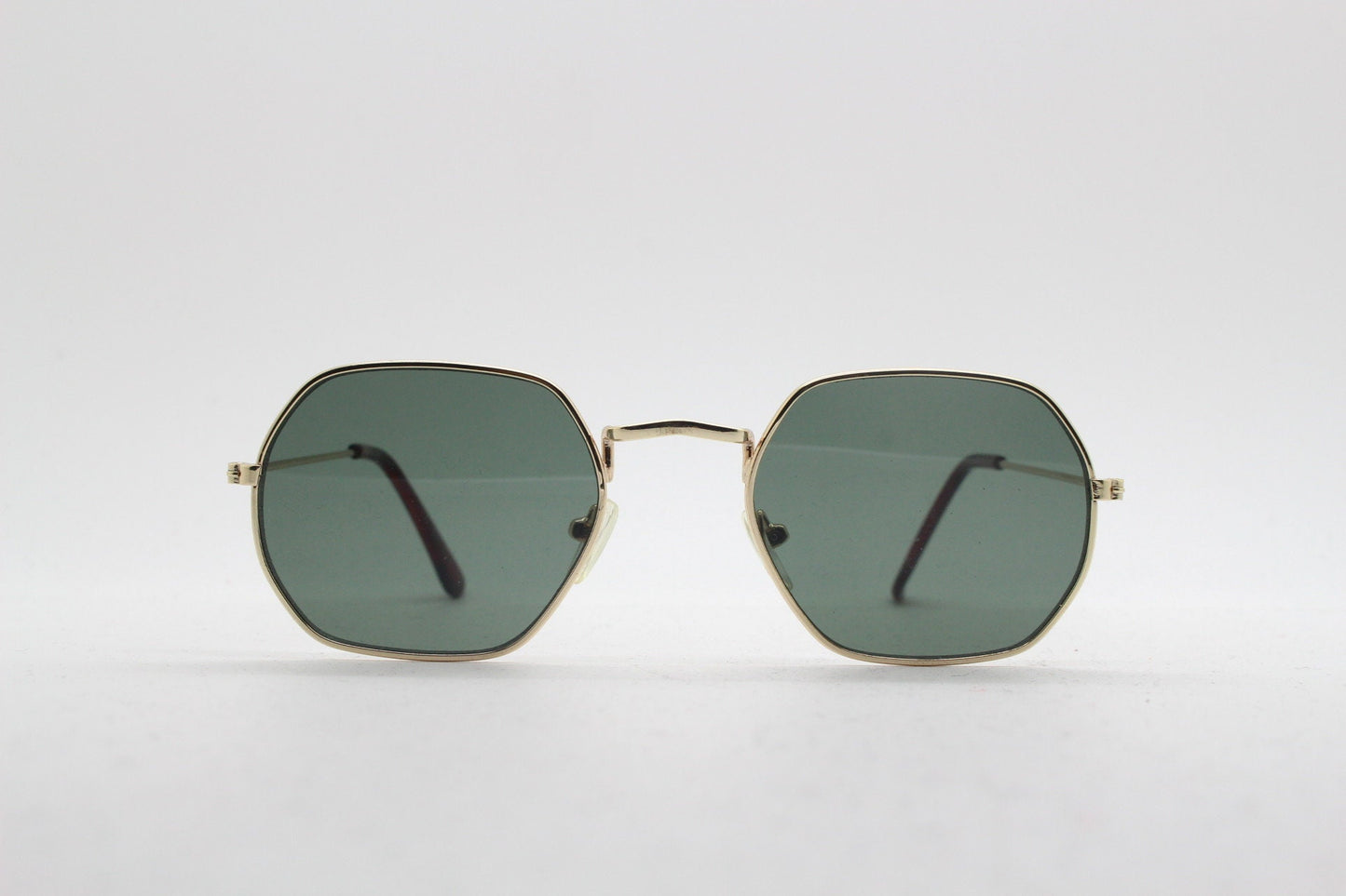 90s vintage hexagon sunglasses. Low profile slim gold 60s design frame with flat green lenses Octagon