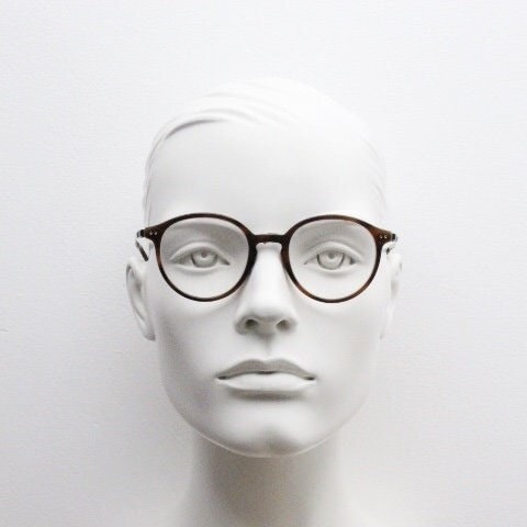 Giorgio Armani eye glasses model 7124 made in Italy. Mottled brown acetate optical frames with flat metal arms. Prescription eyeglasses. RX