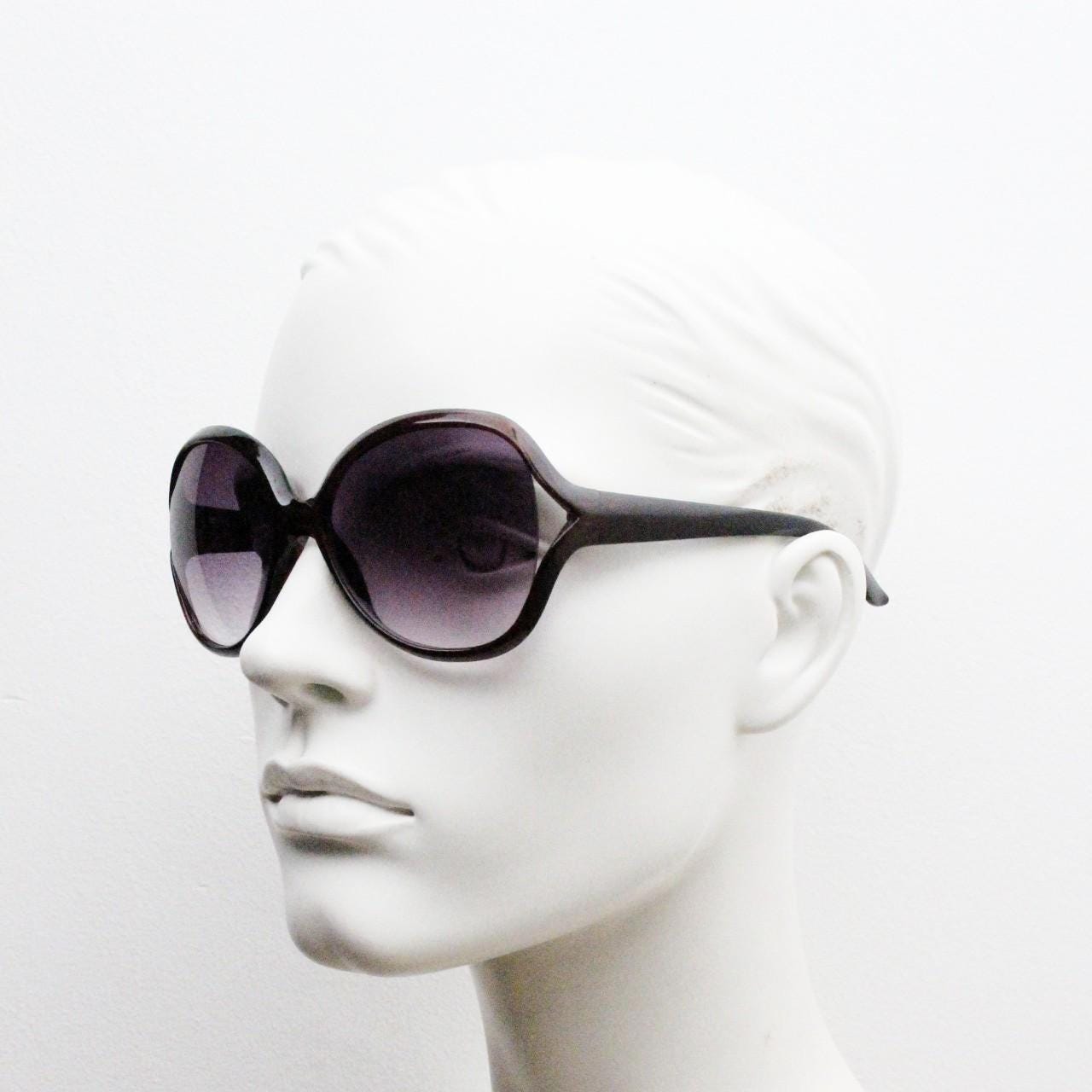 Y2K vintage big round angular sunglasses. Women's 70s design in transparent brown with graduating lenses and forked side detail. 2000s NOS