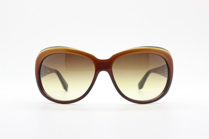 Dita oversized 70s design sunglasses model Pretender made in Japan. Gorgeous brown and black layered acetate. Womens NOS. 60s