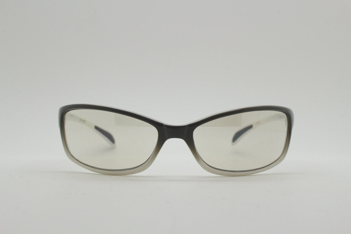 Y2K vintage futuristic sunglasses. Gloss white and grey wrap around shield style frame with light tone lenses. Cosplay visor. 2000s NOS