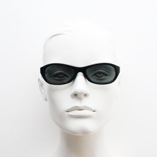 Vintage 90s oval chic cat eye sunglasses made in Italy. Minimalistic plain black acetate frame with green lenses. Womens 60s design. NOS