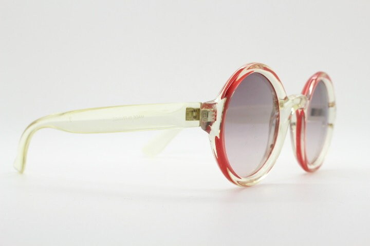 Mary Quant 60s vintage round sunglasses made in France. Yellow crystal transparent lucite frame in with contrasting dark graduating lenses