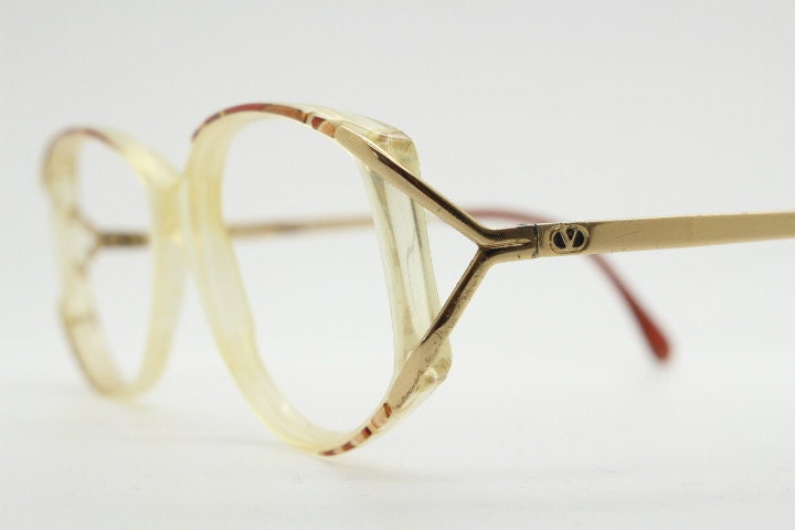 Valentino 90s vintage eye glasses made in Italy. Crystal and abstract pattern optical frames with golden forked arms. Prescription RX