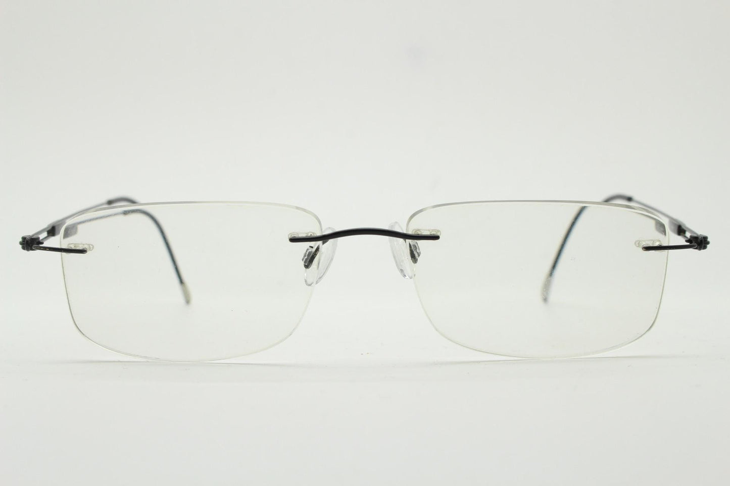 Silhouette rectangular frameless eye glasses made in Austria. Extremely minimal lightweight grey titanium optical frame. Prescription RX
