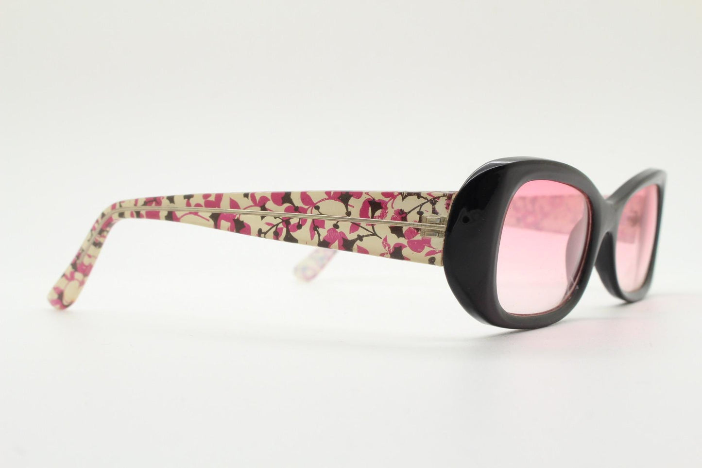 Y2k vintage rectangular cat eye sunglasses. Intense 60s style black front with pink lenses and extraordinary floral arms. 2000s NOS. BNWT