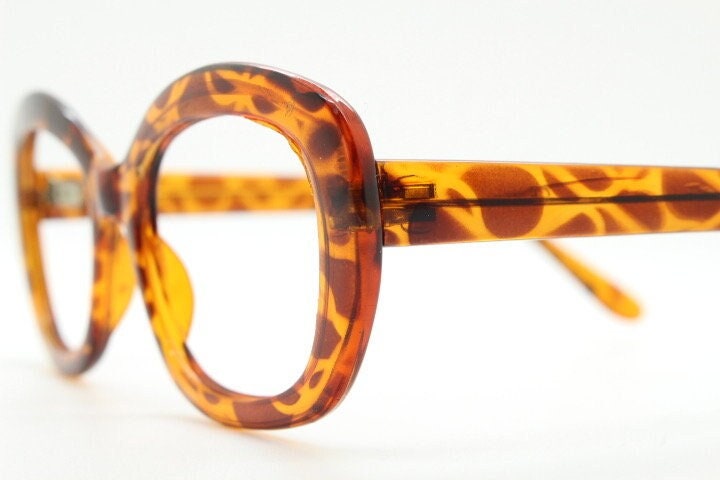 90s vintage angular rounded eye glasses. Transparent vibrant amber giraffe pattern optical frame. Womens prescription eyeglasses. RX