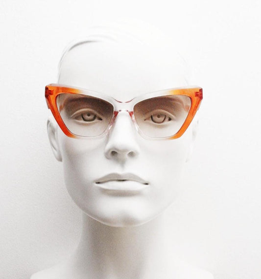 Vintage oversized pointed cat eye sunglasses. Dramatic orange and crystal ombre frame with light tone lenses. NOS