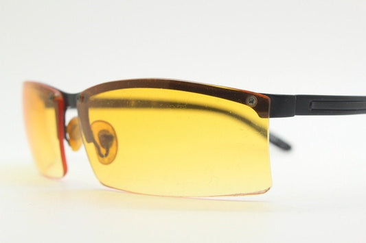 Y2K vintage half frame visor sunglasses. 2000's black brow line with light tone blazing orange rectangular curved lenses. 00's