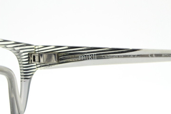 Alain Mikli rectangular eye glasses made in France. Dynamic black and white striped layered acetate grey optical frame. Prescription RX