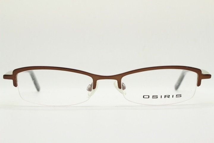 Osiris 90s vintage rectangular half rim eye glasses. Low profile optical frame in handsome brown chrome. Prescription RX Spectacles