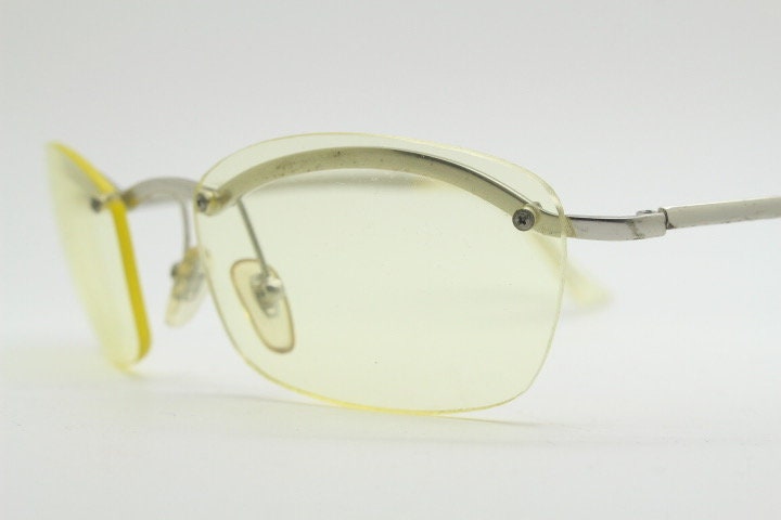 Y2K vintage half frame extra light tone yellow sunglasses with satin alloy brow line. Minimalistic 2000's wrap around design. 00's NOS
