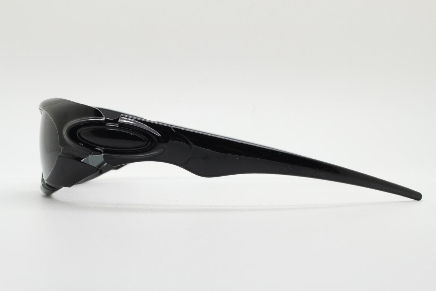 90s vintage sports shield sunglasses. All black gloss aerodynamic wraparound with many stylised features. 2000's. Hells angel uber fashion