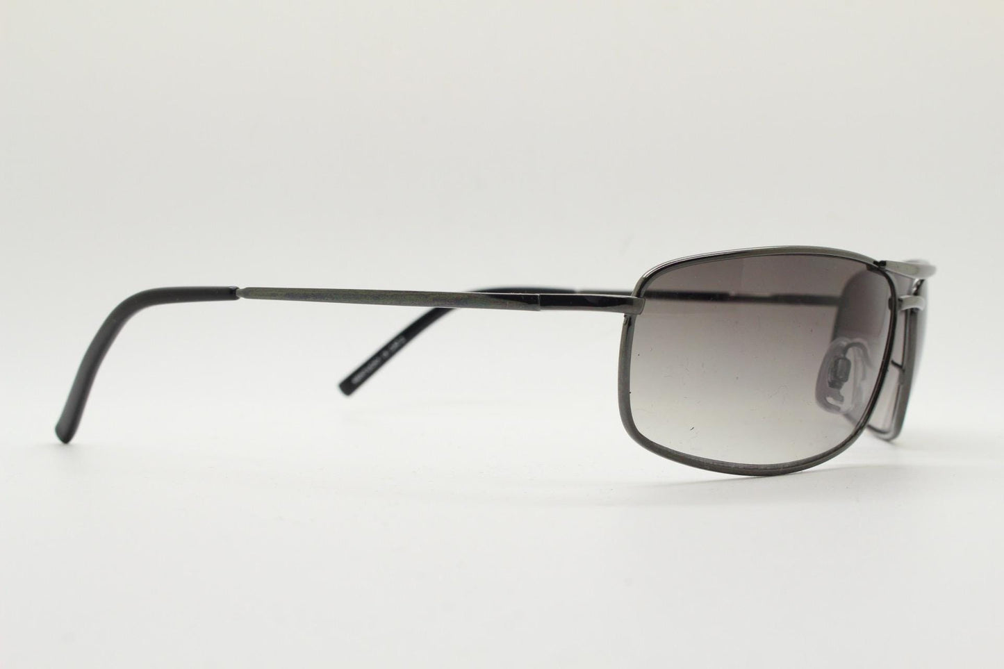90s vintage rectangular wrap around sunglasses. Gunmetal chrome curved frame aviators with light tone gradient lenses. Unused NOS