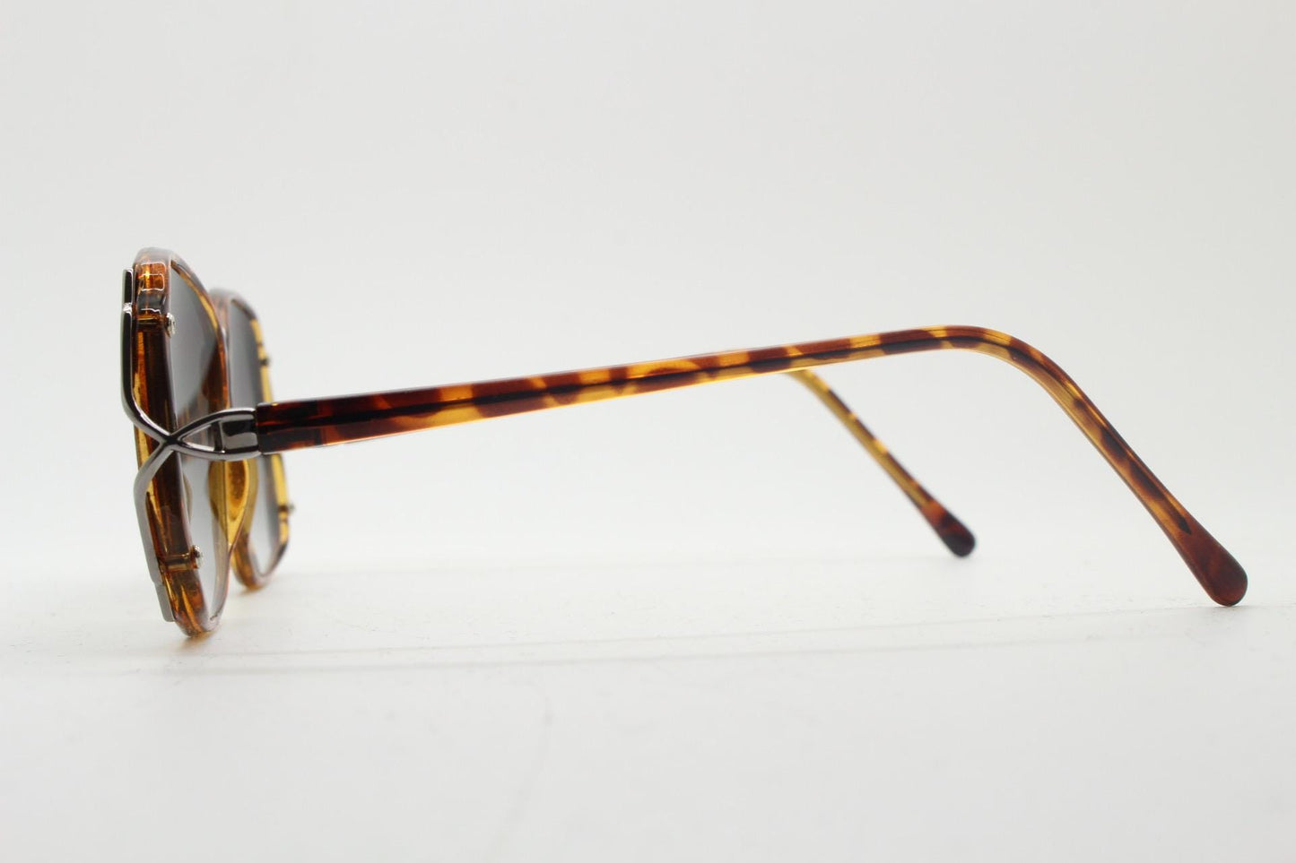 80s vintage square sunglasses. Womens honey tortoise frame with dynamic metal  forked side joints and graduating lenses. 70s. Unused NOS