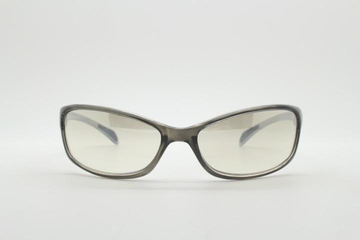 Y2K vintage futuristic sunglasses. Gloss white and grey wrap around shield style frame with light tone lenses. Cosplay visor. 2000s NOS