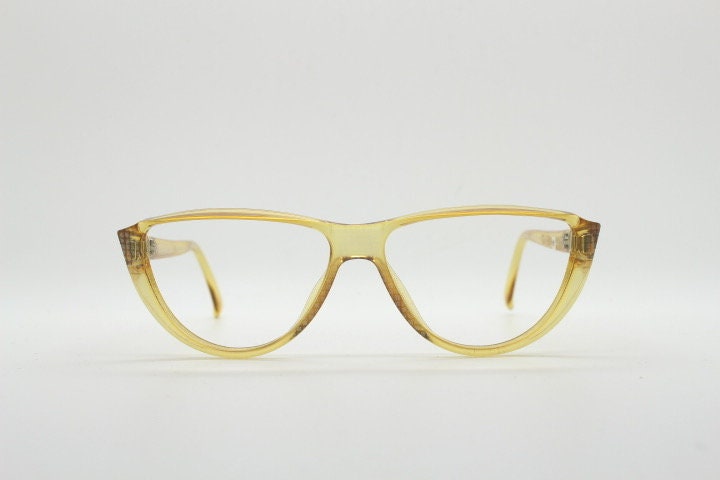 Christian Dior 80s vintage flat top cat eye glasses made in Germany. Transparent yellow optical frame with abstract print. Prescription RX