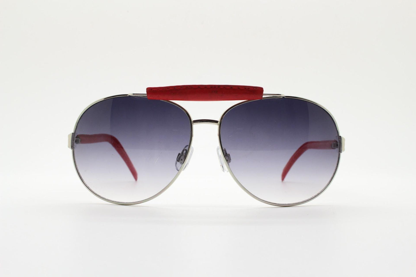 Y2K vintage aviator sunglasses. 2000's silver metal frame with exaggerated bridge in red trim. 70s racing design. 00's NOS aviators