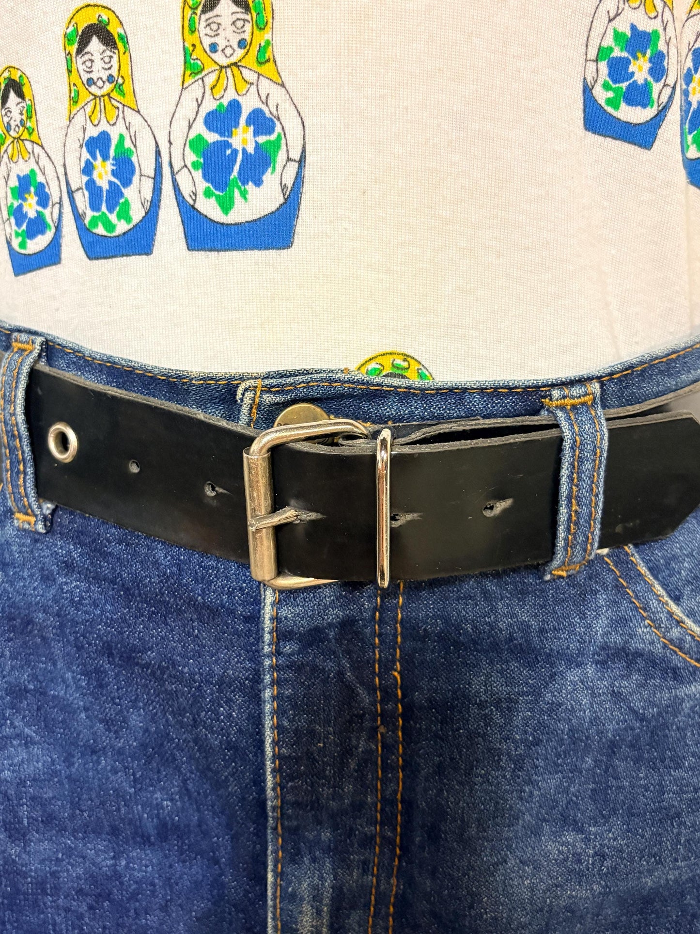 Y2k vintage womens jeans belt with silver buckle and scattered round lace holes. Thick black vinyl. Can be worn with a dress. 2000s NOS