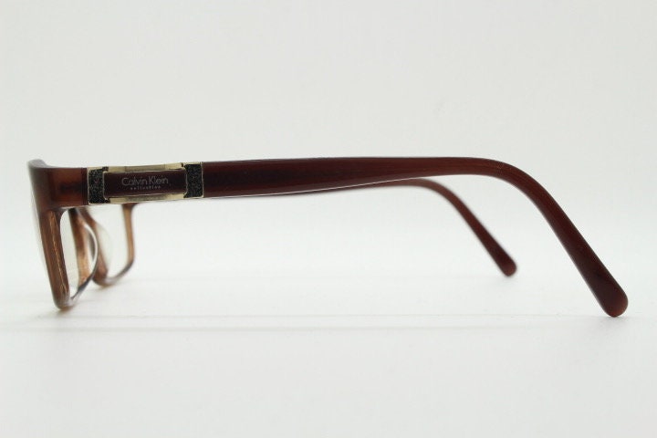 Calvin Klein collection rectangular cat eye glasses model 7851. Tortoise gloss acetate optical frames. Prescription eyeglasses. RX