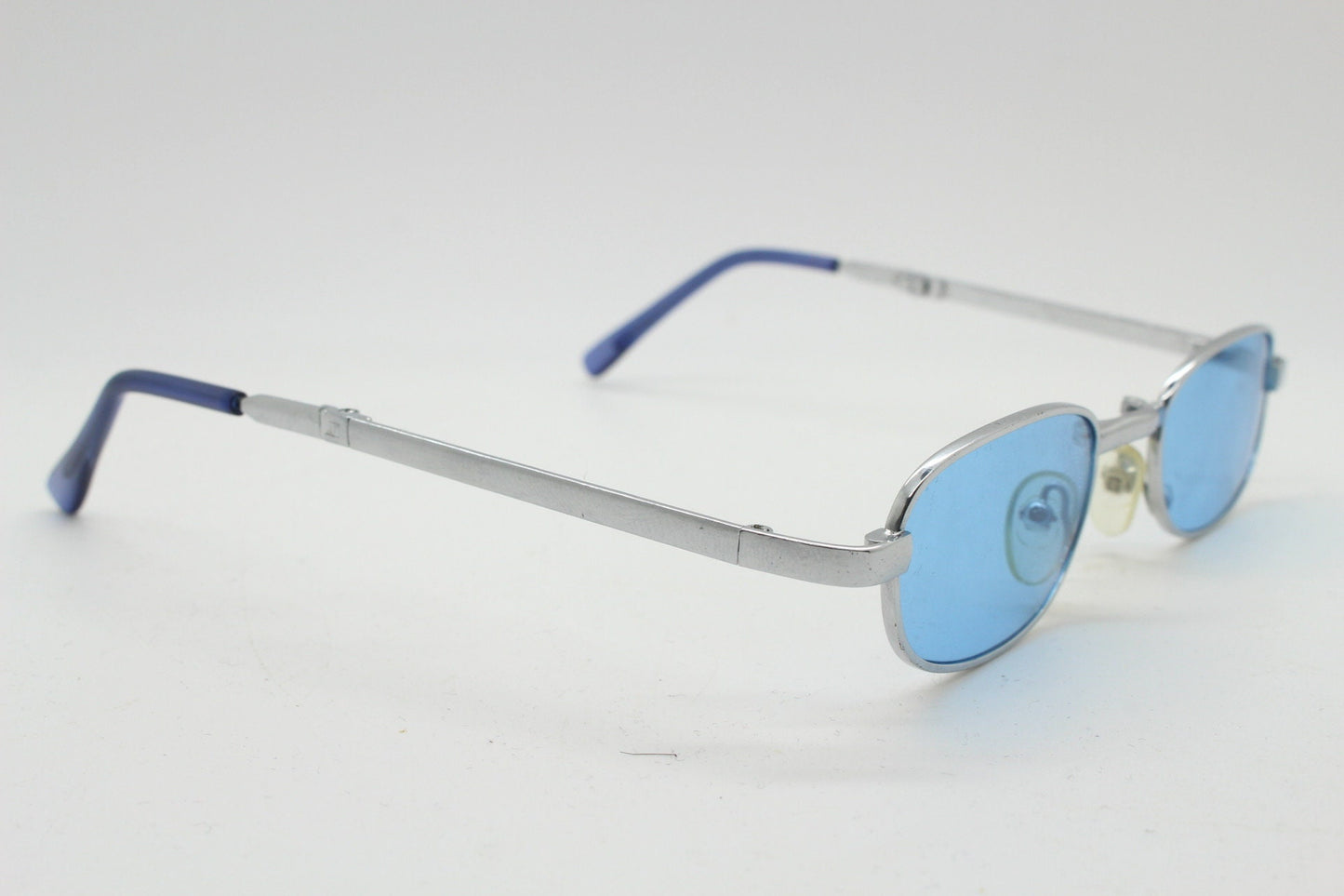 90s micro foldable oval sunglasses. Sky blue lenses in a small silver folding compact frame. Folder. Rave 2000s. Y2K. NOS
