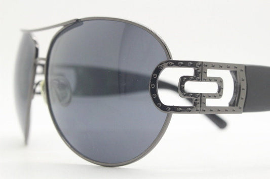 Y2K vintage oversized aviator sunglasses. Classic teardrop aviators in gunmetal grey with radical 2000s arm design. Unworn NOS