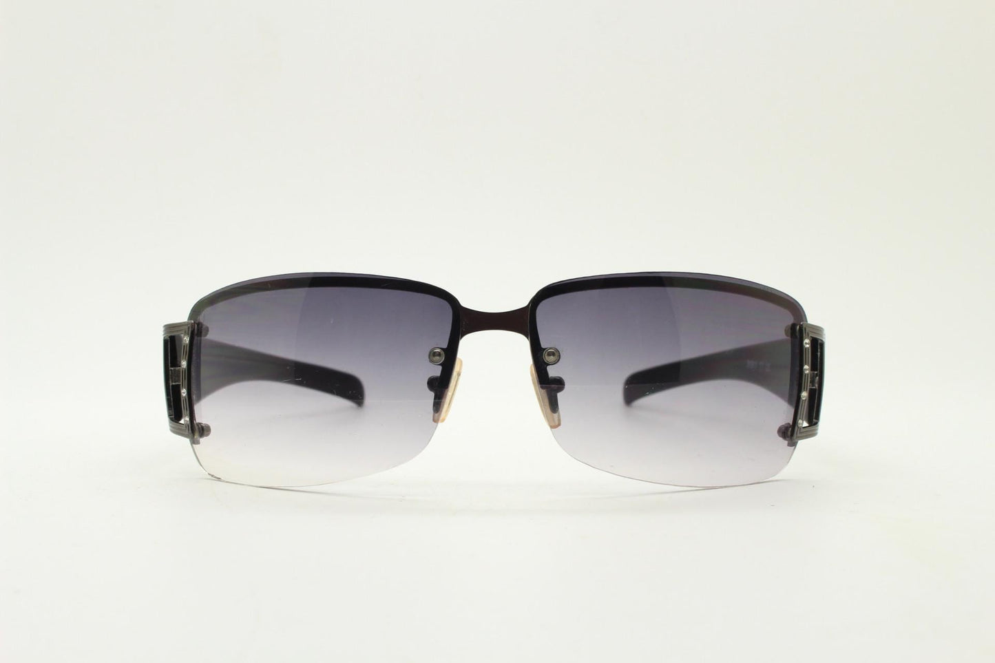 Y2K vintage rectangular wrap around sunglasses. Black half frame with grey metal trim, diamante detail and graduating lenses. Rhinestone