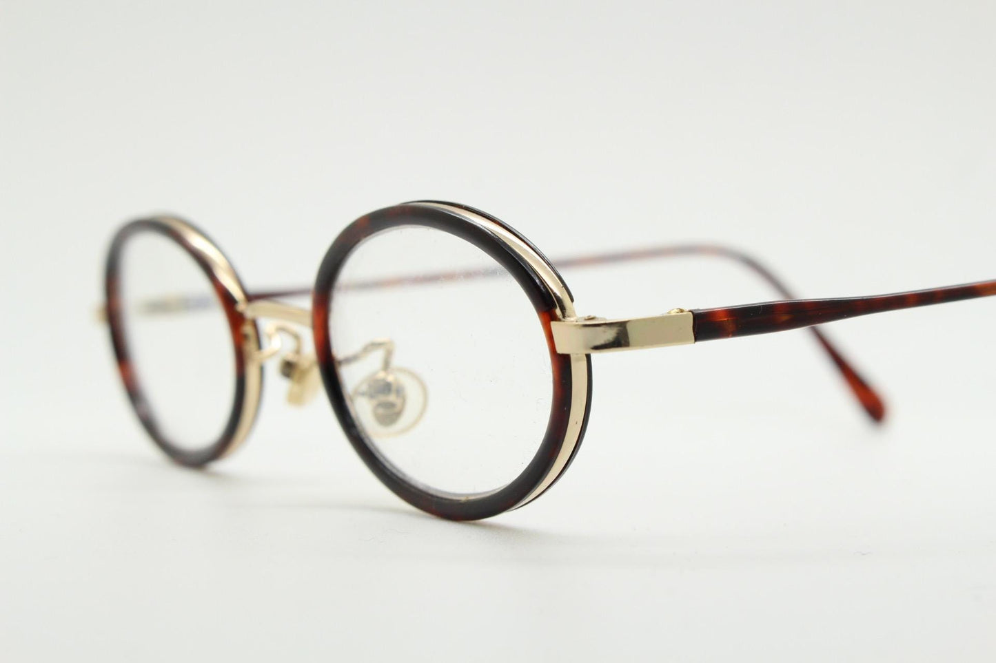 90s vintage small oval eye glasses. Gold metal frame 20s design optical frames with tortoise inserts and arms. Prescription. Spectacles NOS