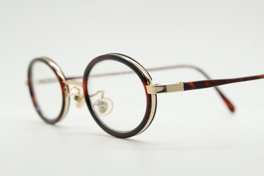 90s vintage small oval eye glasses. Gold metal frame 20s design optical frames with tortoise inserts and arms. Prescription. Spectacles NOS