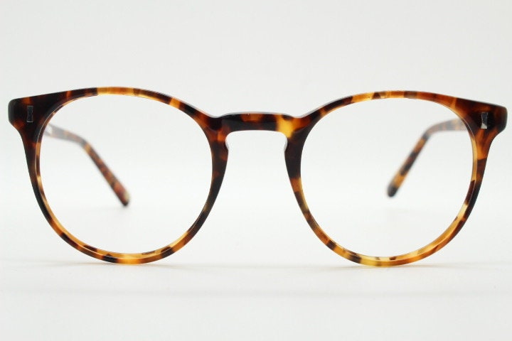 Cubitts vintage round 40s design hand made eye glasses. Honey tortoise acetate optical frame with keyhole bridge. Prescription RX