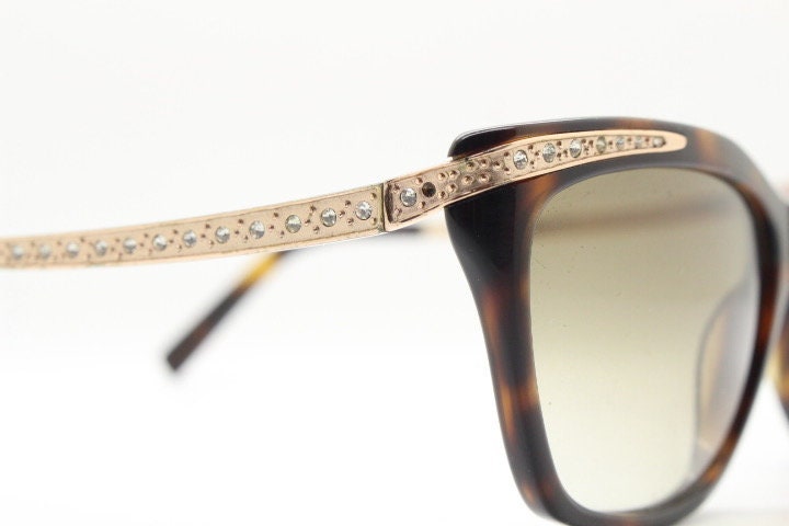 Borsalino cat eye sunglasses made in Italy model 250. Womens Tortoise acetate frame with dramatic diamante golden arms. Rhinestone cateye