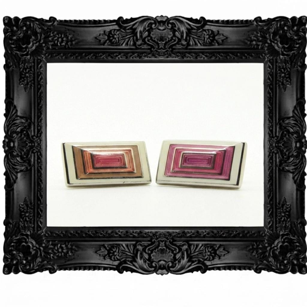Vintage rectangular cuff links made in England by Herringbone. Solid metal construction with fine enamelled white, pink and peach tones. NOS